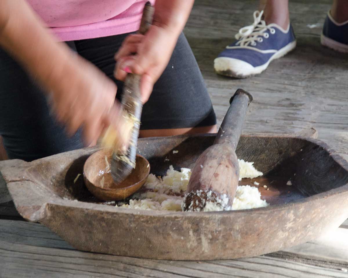 Grating sweet potato to start the Chicha de Yuca, Puerto Napo, Ecuador | ©Angela Drake Grating sweet potato to start the Chicha de Yuca, Puerto Napo, Ecuador | ©Angela Drake