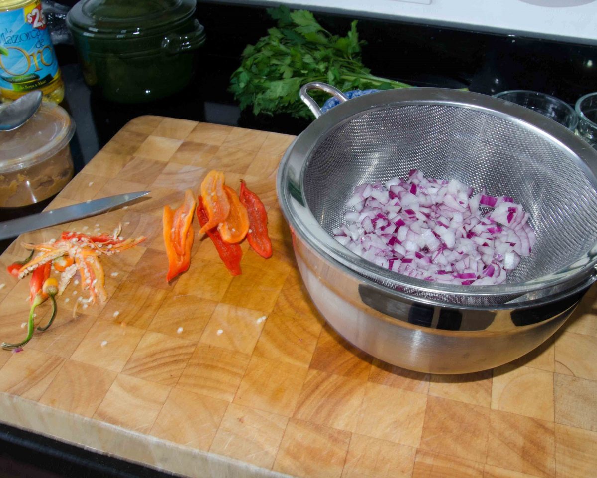 Diced onion and seeding hot peppers Preparing Ingredients for Ecuadorian Hot Sauce